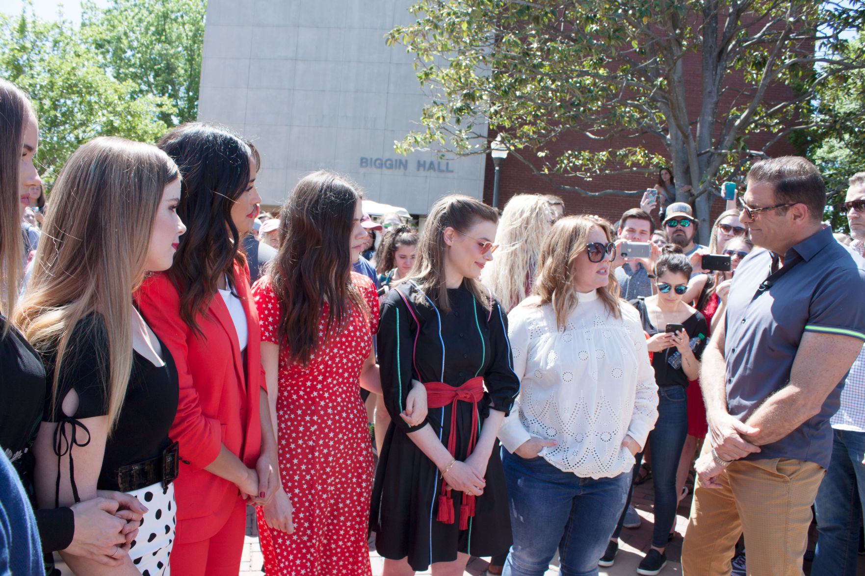 Melissa with cast members during a campus interview